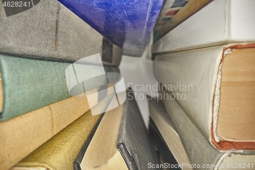 Image of Piled up books macro view between them