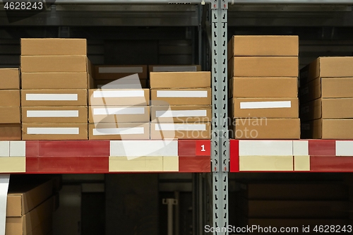 Image of Warehouse stocked with boxes in stacks