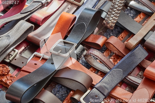 Image of Leather belts at a market