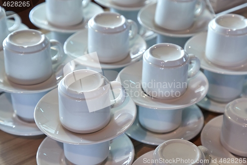 Image of Clean coffee cups piled up