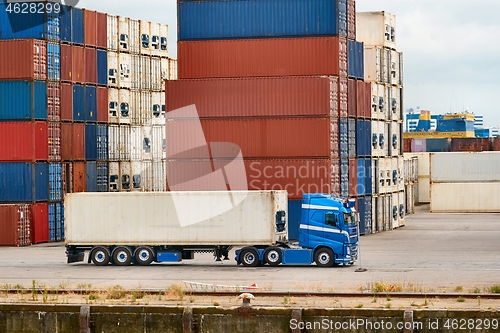 Image of Container terminal in Rotterdam with truck in front of stack of containers