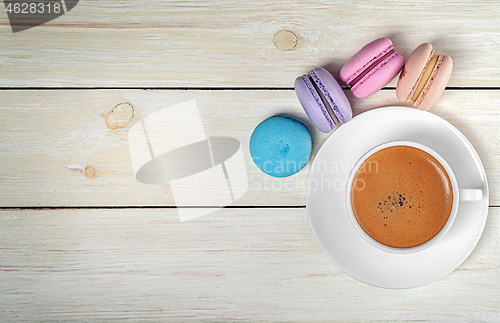Image of Macaroons and cup with coffee on top