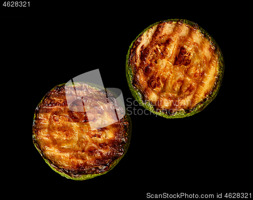 Image of Two slices of zucchini grill