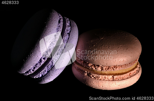 Image of Two macaroons darkened in black