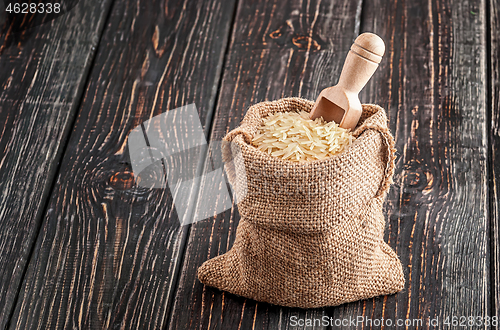 Image of Sack with rice and spoon stands