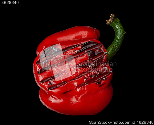 Image of Grilled red pepper on black background