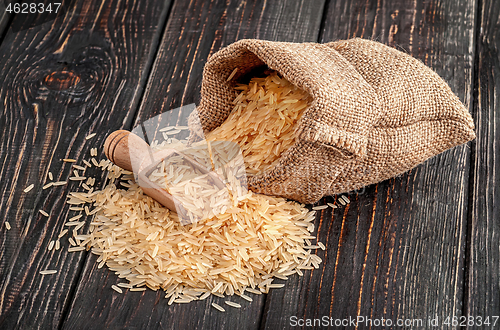 Image of Sack with rice and spoon lies