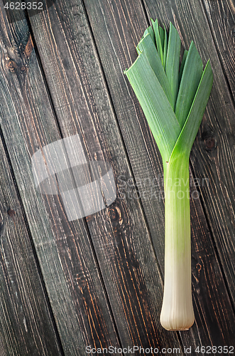 Image of Leek on a wooden background