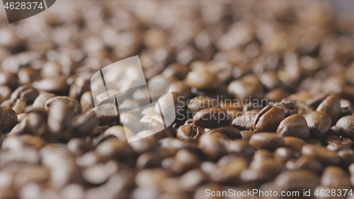 Image of Macro video falling roasted coffee beans closeup. Slow motion, Full HD video, 240fps, 1080p.