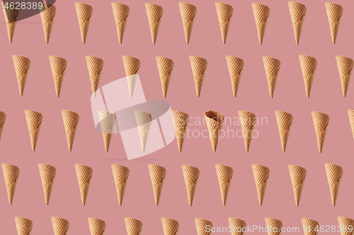 Image of Horizontal pattern with flying waffle cones for ice cream or gelato.