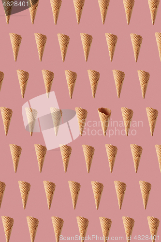 Image of Flying crunchy waffle cones pattern for making sweet ice cream.