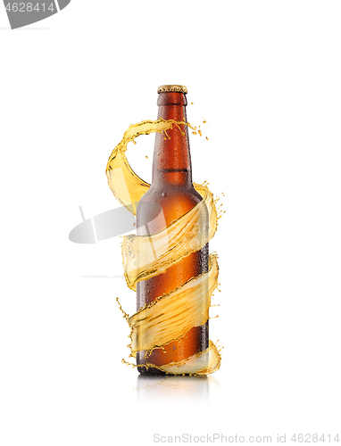 Image of Spiral beer\'s splash around brown bottle on a white background.