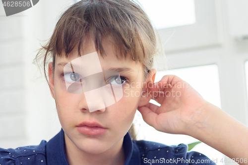 Image of Close-up portrait of a girl with pronounced negative emotions