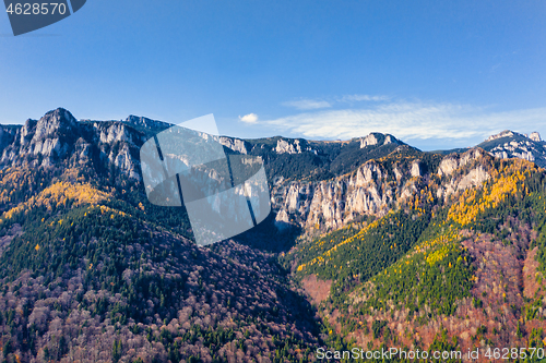 Image of Aerial view of rocky mountain in autumn