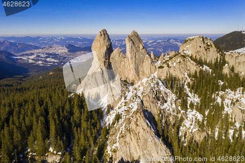 Image of Aerial view of rocky mountain top in winter