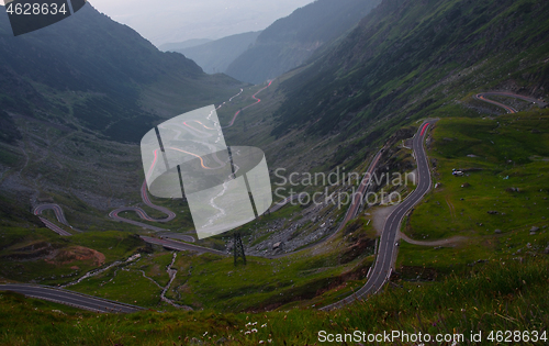 Image of Curvy road in mountains, traffic lights