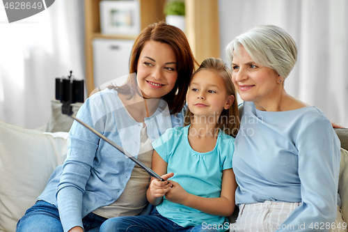 Image of mother, daughter and grandmother taking selfie