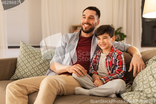 Image of portrait of happy father and little son at home