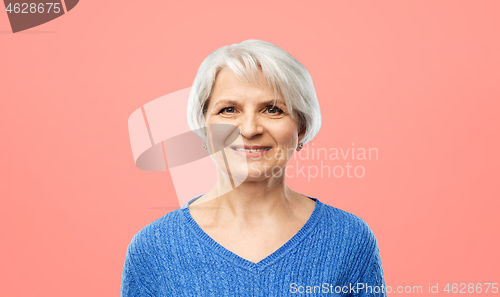 Image of portrait of smiling senior woman in blue sweater