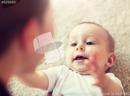 Image of close up of happy little baby and mother