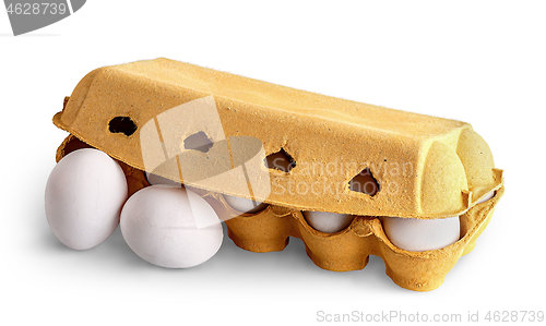 Image of Closed egg tray and two eggs in front