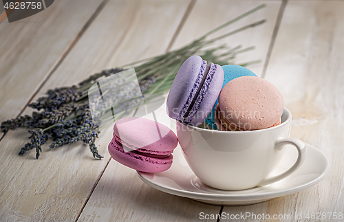 Image of Macaroons in white cup with lavender