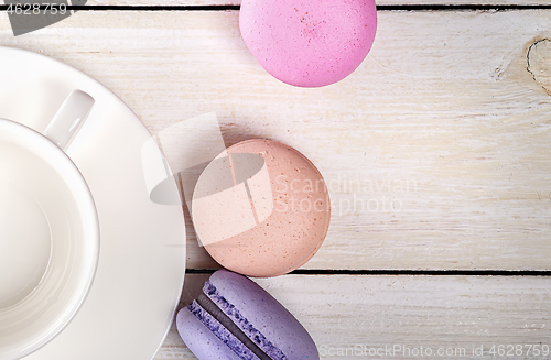 Image of Macaroons and coffee cup closeup top view