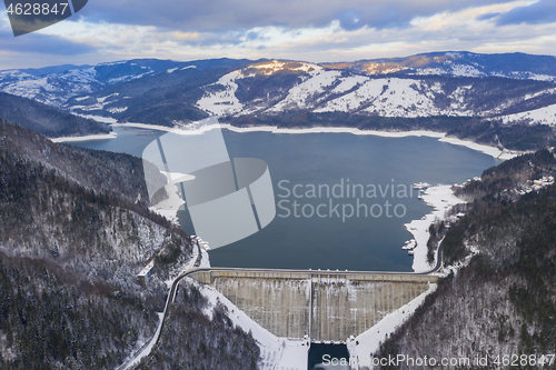 Image of Energy dam and road, aerial winter scene