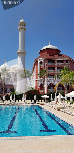 Image of Swimming pool and hotel