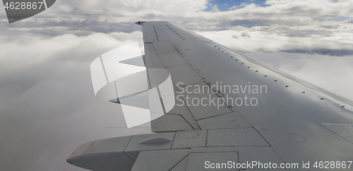 Image of Plane wing and clouds