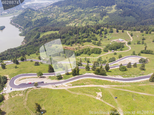 Image of Aerial view of curvy road on mountain