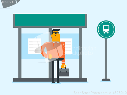 Image of Caucasian man waiting for a bus at the bus stop.