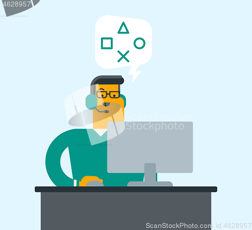 Image of Man using headset and computer in call center.