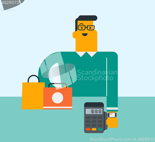 Image of Caucasian man paying wireless with a smart watch.