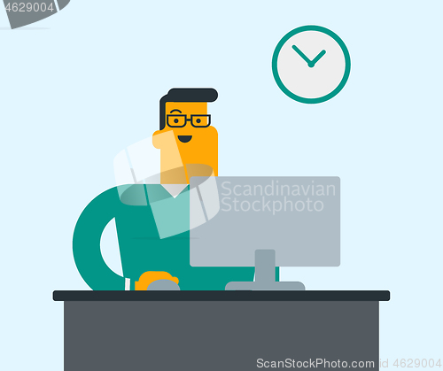 Image of Young caucasian office worker working on computer.