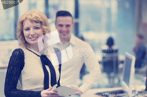 Image of Business People Working With Tablet in startup office