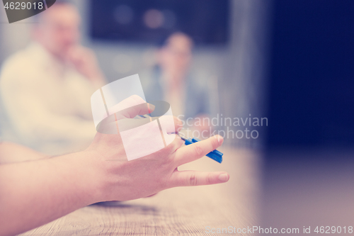 Image of businessman hand using pen