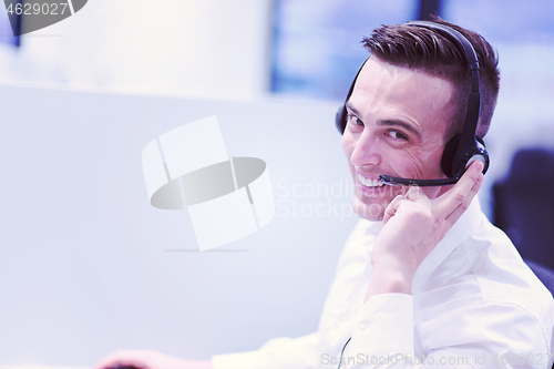 Image of male call centre operator doing his job