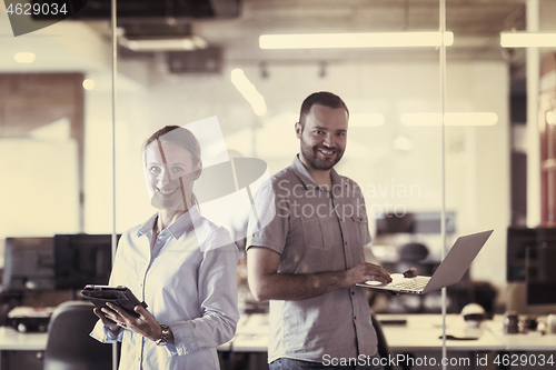 Image of business couple at office