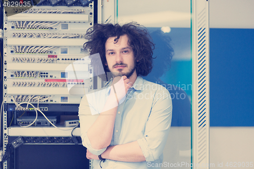 Image of business man engeneer in datacenter server room