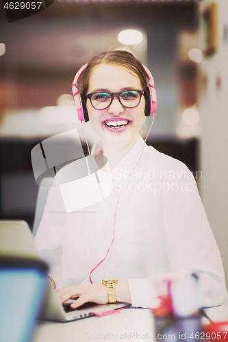 Image of businesswoman using a laptop in startup office