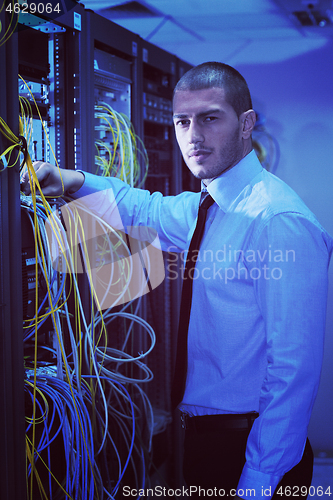 Image of young it engineer in datacenter server room