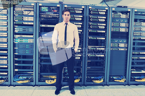 Image of young it engineer in datacenter server room