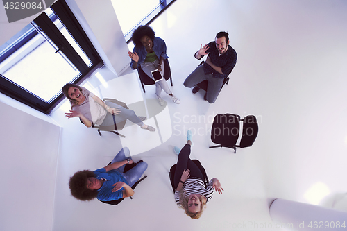 Image of Multiethnic startup business team on meeting  top view