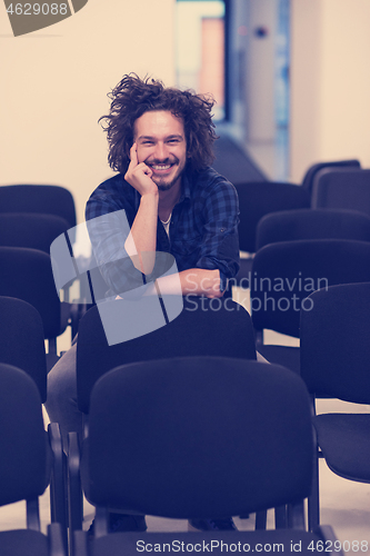 Image of A student sits alone  in a classroom