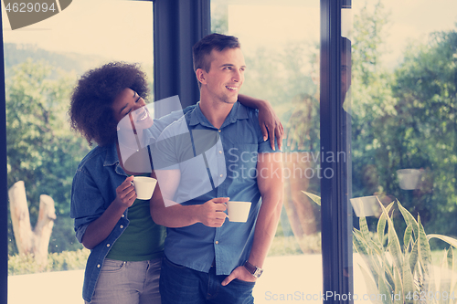 Image of romantic happy young couple relax at modern home indoors