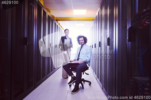 Image of Team of young technicians working together on servers