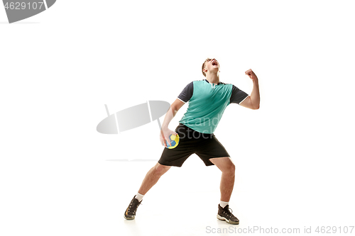 Image of The one caucasian young man as handball player at studio on white background