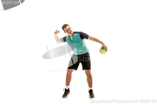 Image of The one caucasian young man as handball player at studio on white background