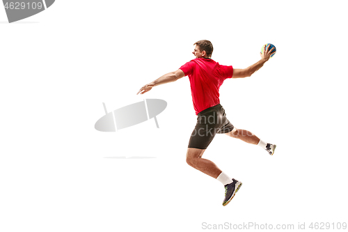 Image of The one caucasian young man as handball player at studio on white background